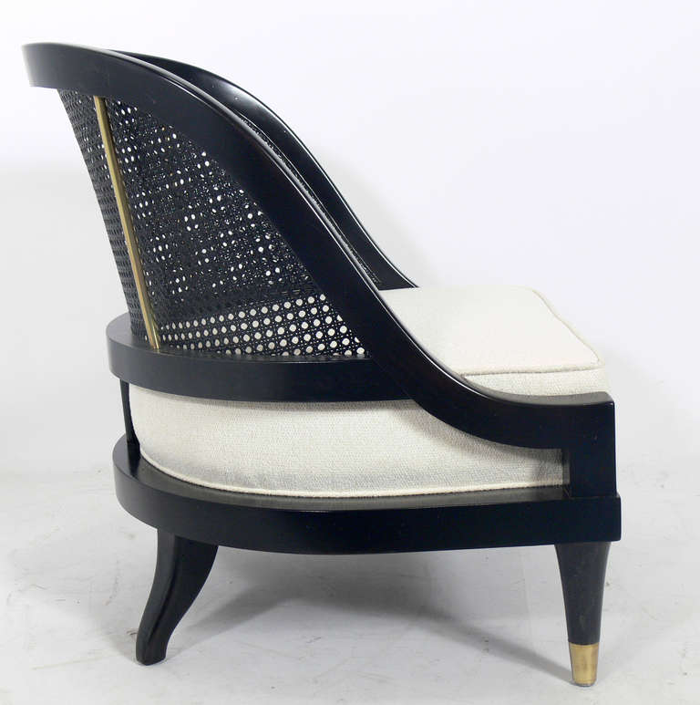 Hollywood Regency Pair of Curvaceous Black Lacquer and Brass Slipper Chairs