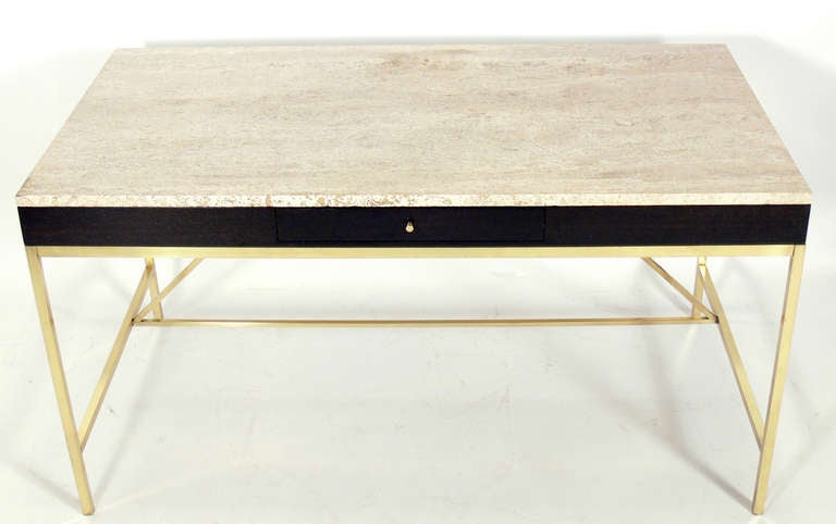 Modernist Travertine and Brass Desk, designed by Paul McCobb for Calvin, circa 1950's. Refinished in an ultra deep brown lacquer, brass hand polished and lacquered.