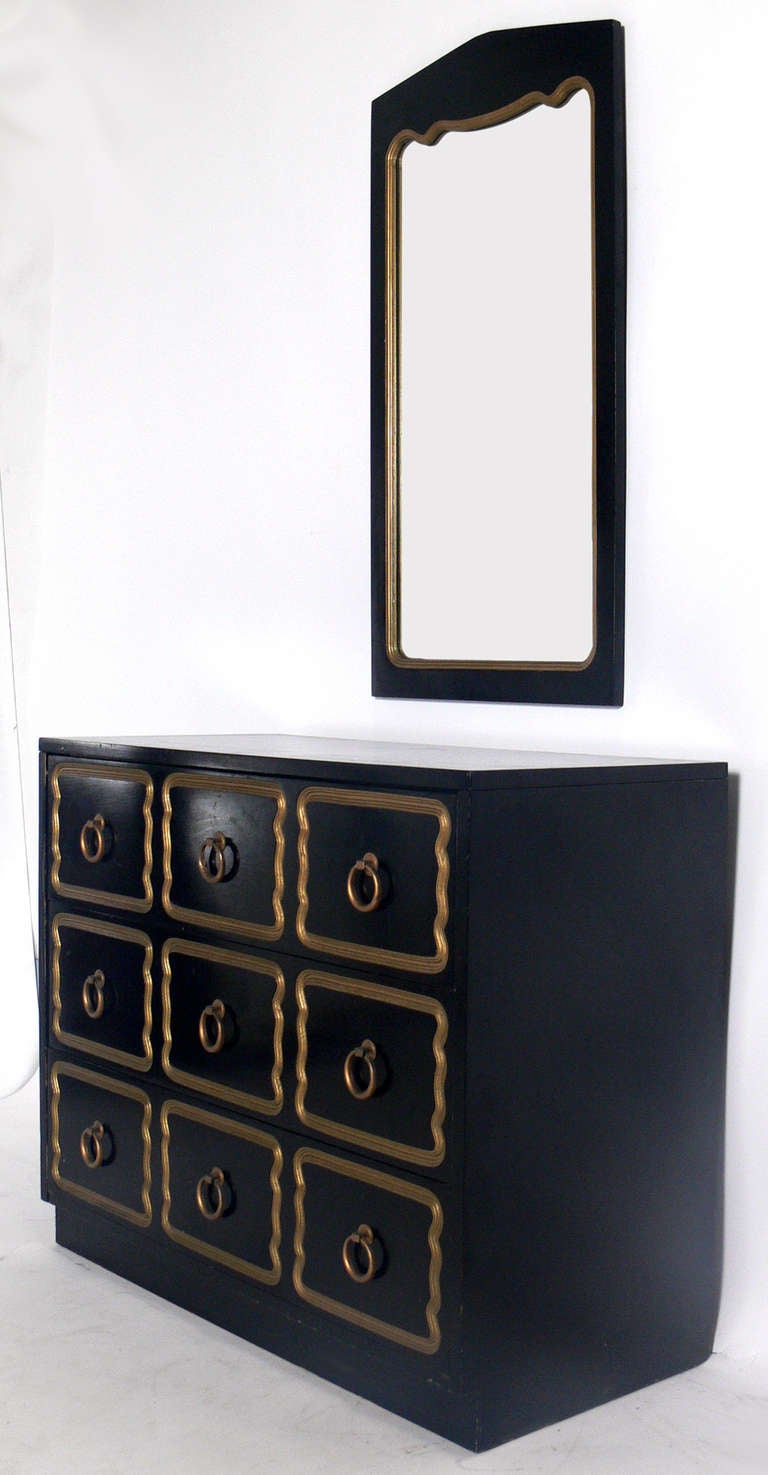 Black Lacquered and Gilt Chest and Mirror attributed to Dorothy Draper, unsigned, circa 1960's. The price noted below includes the chest and mirror. If you would like to purchase them separately, the chest is $3000 and the mirror is $1000 each. The