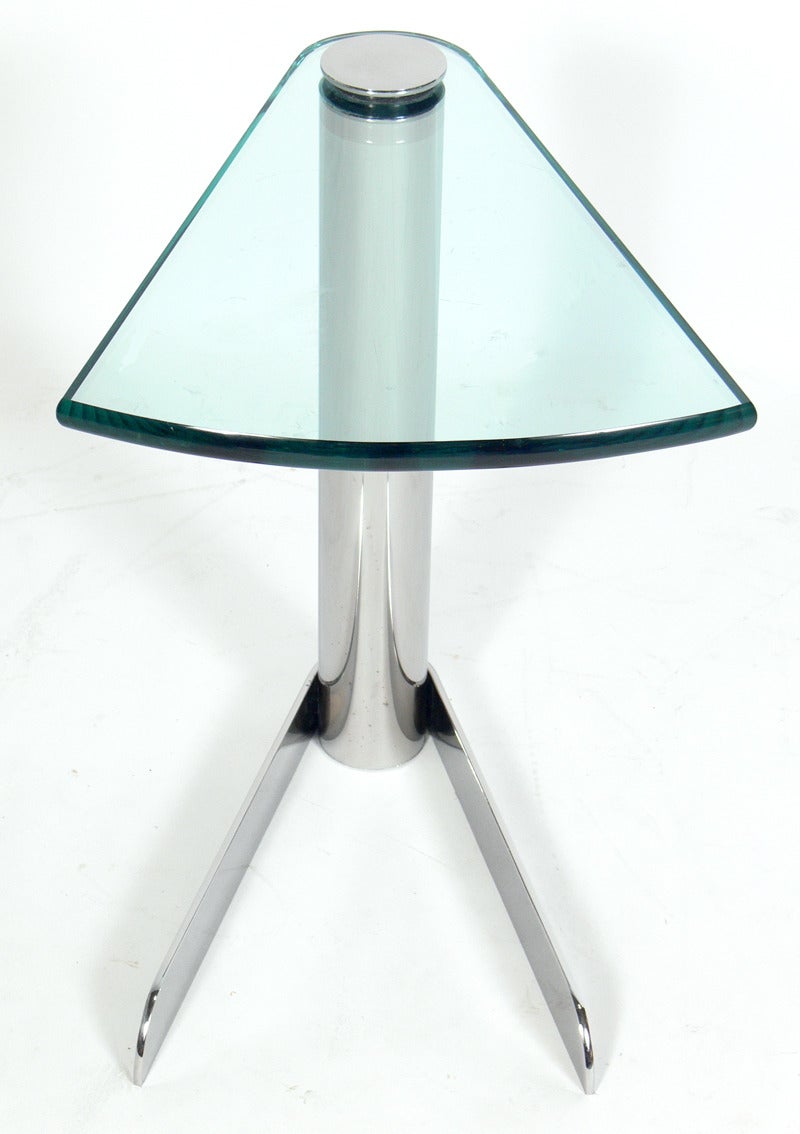 Sleek Chrome and Glass Table in the manner of Karl Springer, American, circa 1970's. This table is a versatile size and would work as an end or side table, a night stand, or as an occasional table between two chairs.