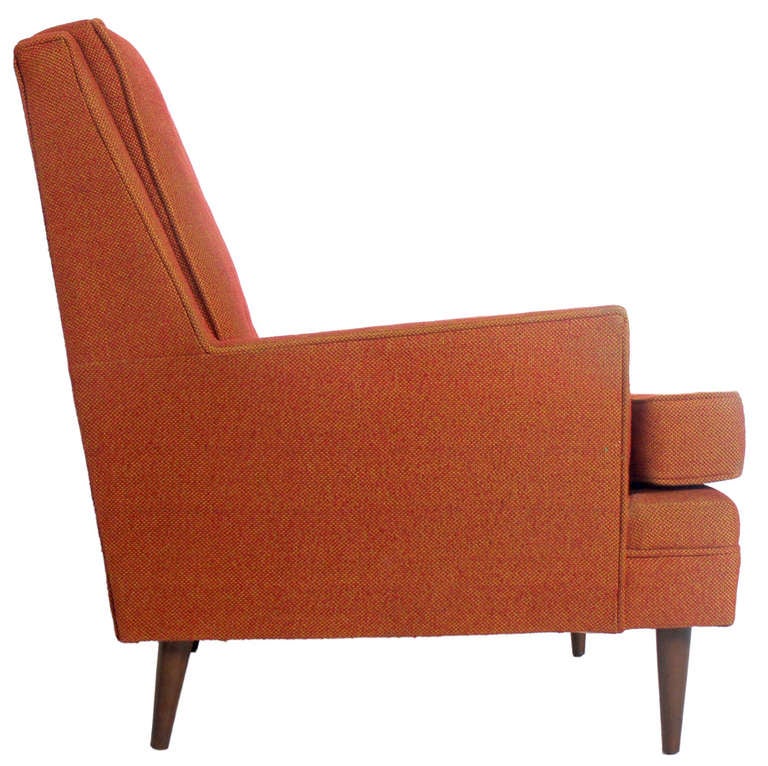 Pair of Clean Lined Modernist Lounge Chairs in the manner of Paul McCobb, American, circa 1950's. These chairs are currently being refinished and reupholstered. The price noted below includes refinishing in your choice of color lacquer on the feet,