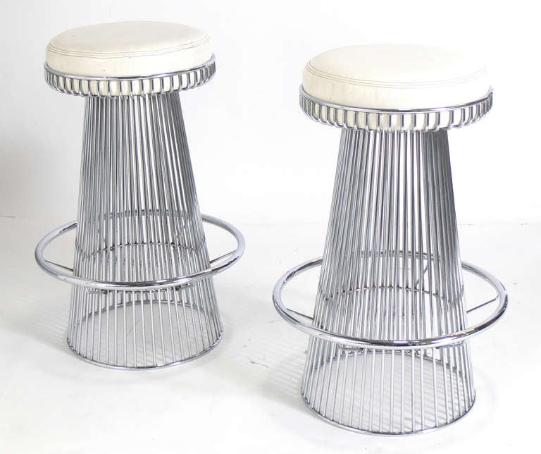 Pair of Sculptural Chrome Bar Stools after Warren Platner, American, circa 1960's. They are a versatile size and would work at a kitchen counter or bar. The price noted in this listing is for the pair of stools. They are currently upholstered in