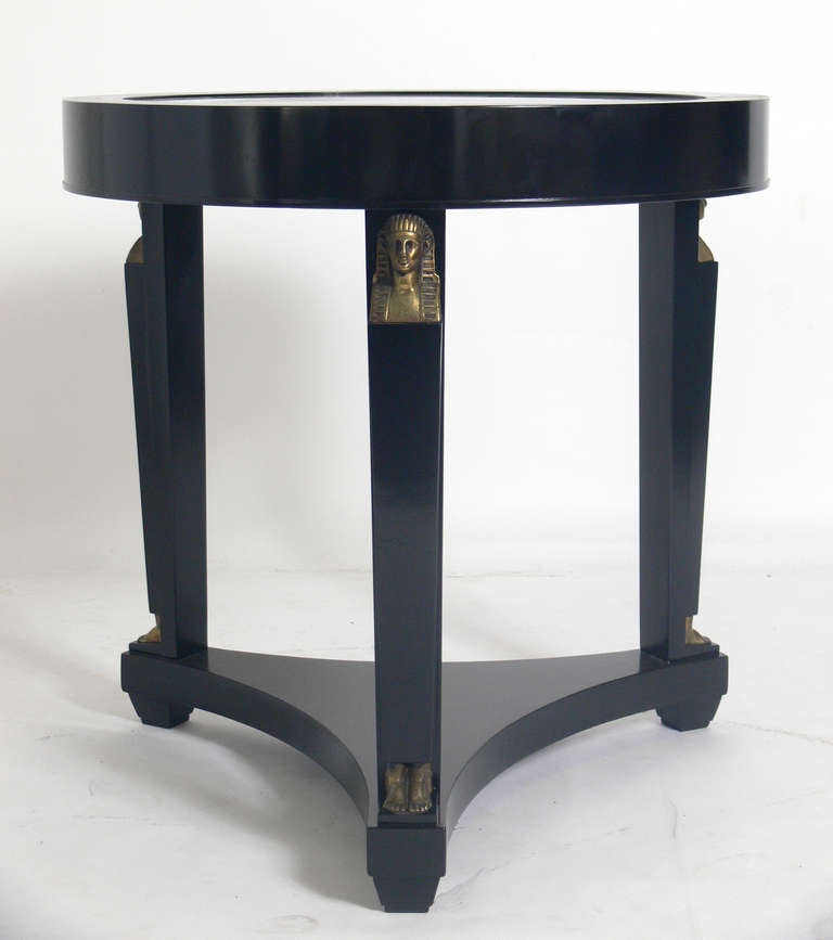 Egyptian Revival Table, probably French, circa 1930's. Interest in all things Egyptian grew after the discovery of King Tut's tomb in 1922. This Egyptian Revival table has an elegant neoclassical form, and has been recently refinished in black