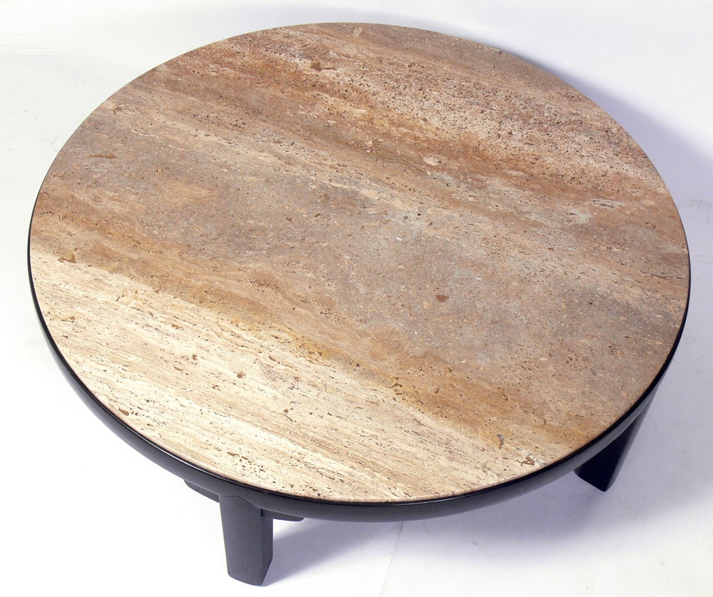 Clean lined modern coffee table, designed by Edward Wormley for Dunbar, circa 1950s. This piece exhibits Wormley's interest in simple, Asian influenced forms. It has a beautiful travertine top with tan, brown, and grey veining.