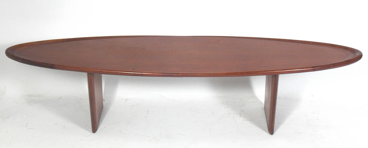 Modern Surfboard Coffee Table, designed by T.H. Robsjohn Gibbings for Widdicomb, circa 1950s. This table is currently being refinished and can be completed in your choice of color. The price noted below INCLUDES refinishing in your choice of color.