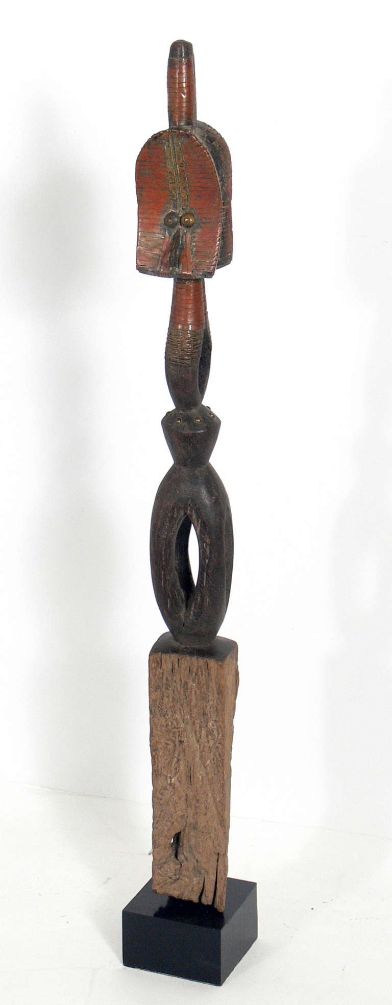 African Reliquary Sculpture with Modernist Design, most likely executed by the African DRC Kota Mahongwe people, 20th century. Mounted on a new black lacquer base.  Many modernist artists, including Picasso and Modigliani, collected African art and