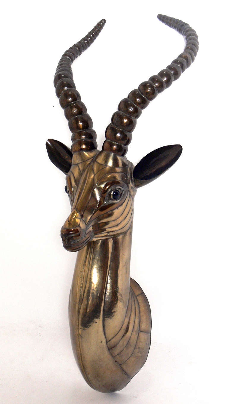 Sculptural Antelope Head by Sergio Bustamante, Mexico, circa 1970's. Bustamante's unique animal sculptures are often compared with his French contemporary, Francois-Xavier Lalanne.