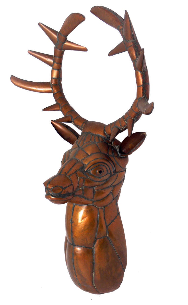Sculptural Stag Head by Sergio Bustamante, Mexico, circa 1970's. Signed and numbered, Sergio Bustamante, 60/100. Bustamante's unique animal sculptures are often compared with his French contemporary, Francois-Xavier Lalanne.