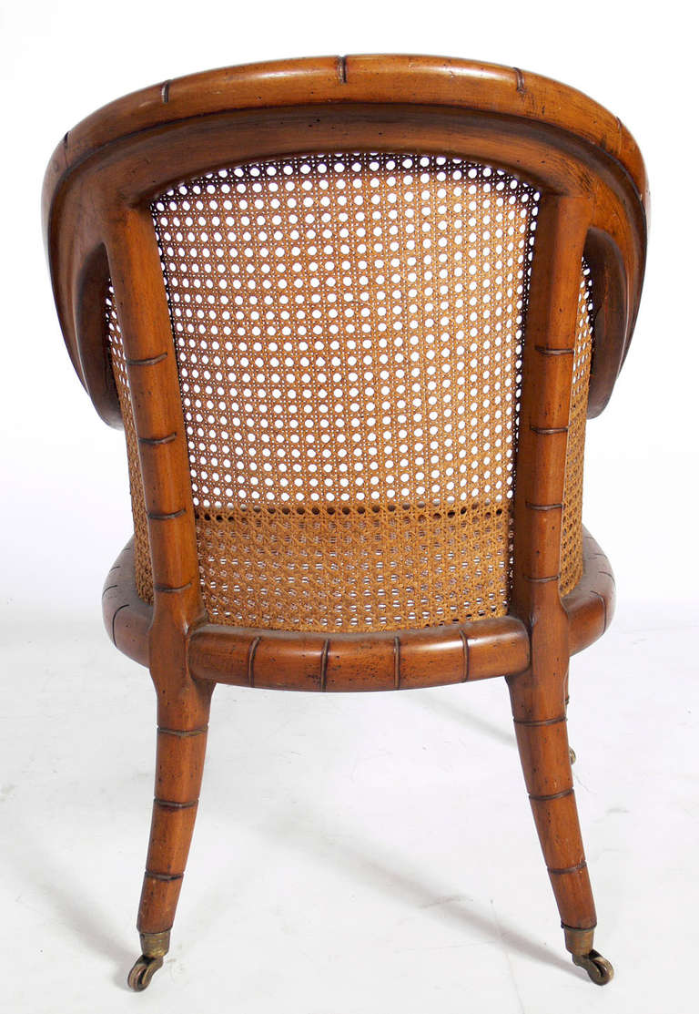 Curvaceous Caned Faux Bamboo Armchair with Brass Hardware In Good Condition In Atlanta, GA
