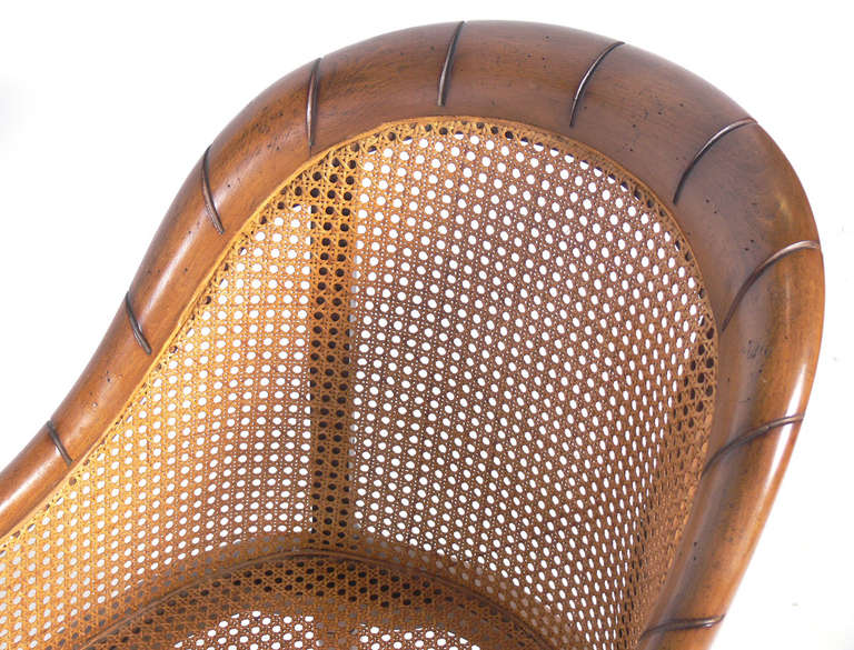 Mid-20th Century Curvaceous Caned Faux Bamboo Armchair with Brass Hardware