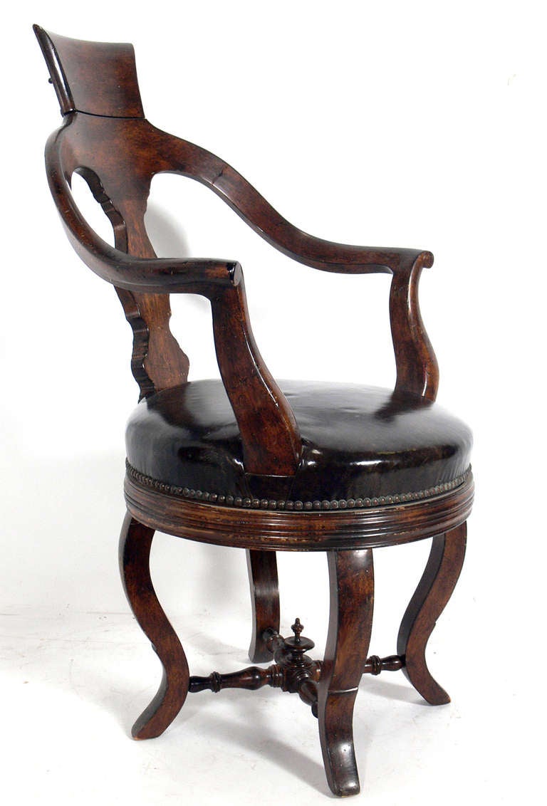 Antique 19th Century Dentist Chair, believed to be American, circa late 1800's. Elegant, sculptural form.