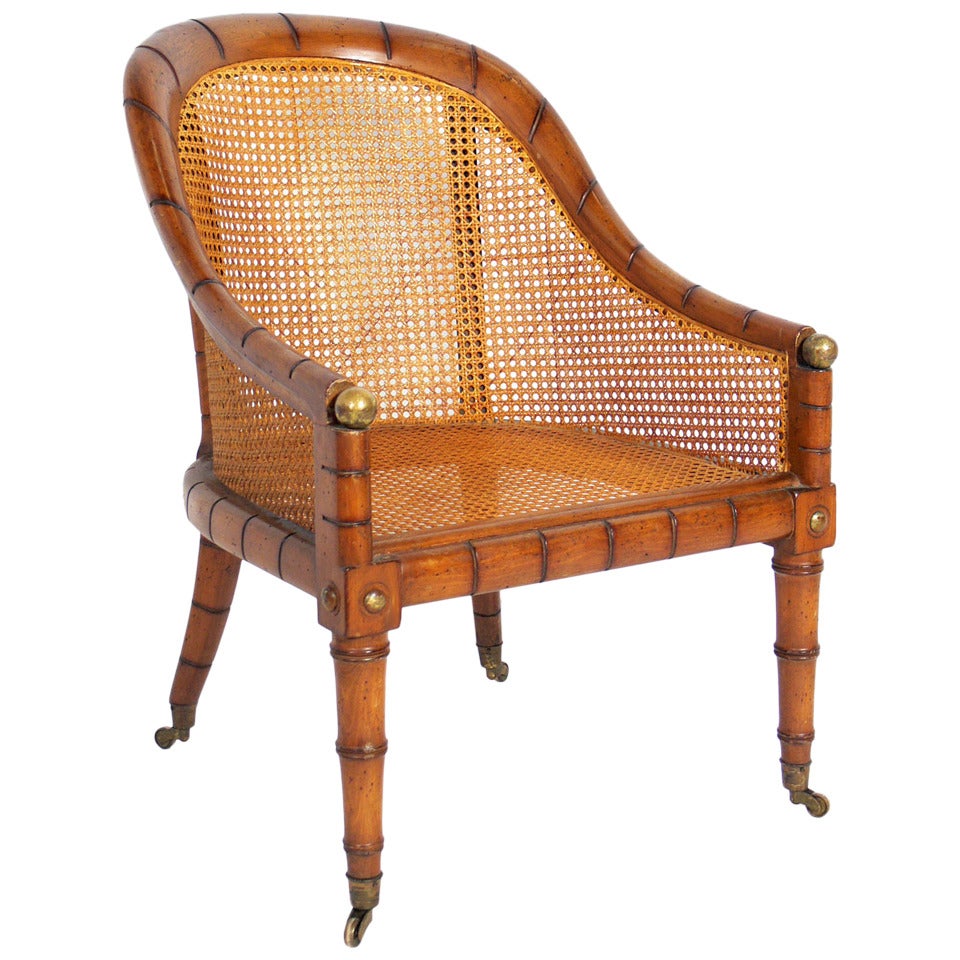 Curvaceous Caned Faux Bamboo Armchair with Brass Hardware