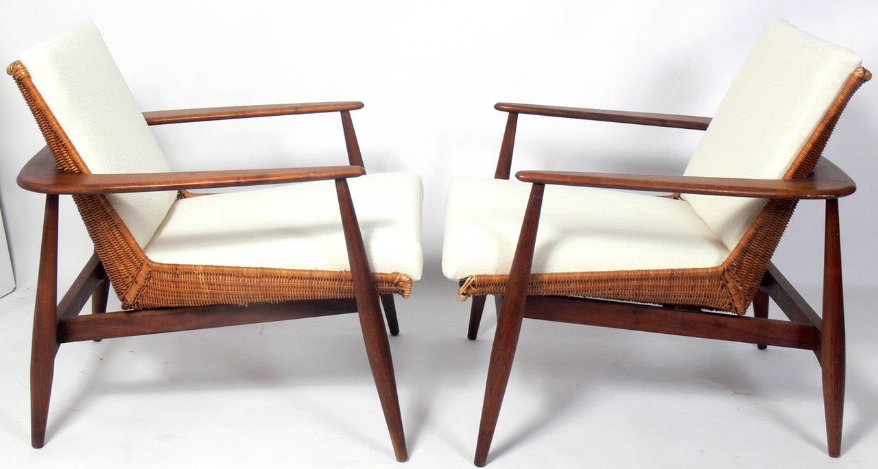 Pair of Danish Modern Style Lounge Chairs, designed by Lawrence Peabody for Richardson and Nemschoff, American, circa 1950s. Very comfortable pair of chairs with an outstanding design featuring wrap around arms and caned seats that look great from