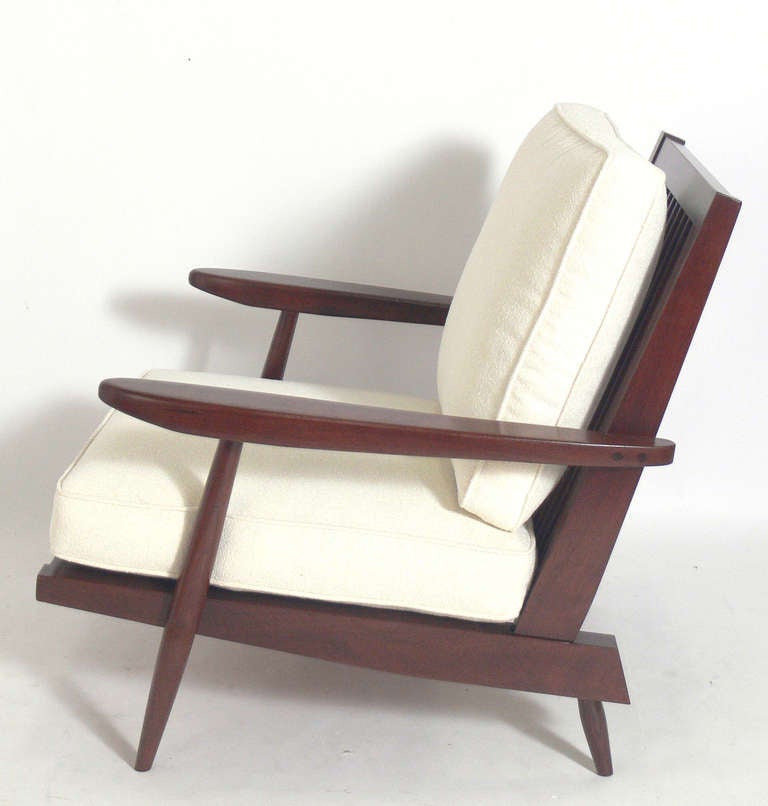Modernist Lounge Chair, made by George Nakashima, circa 1960's. Refinished, reupholstered in an ivory color boucle fabric and ready to use. Provenance: Letter of authentication from Mira Nakashima.