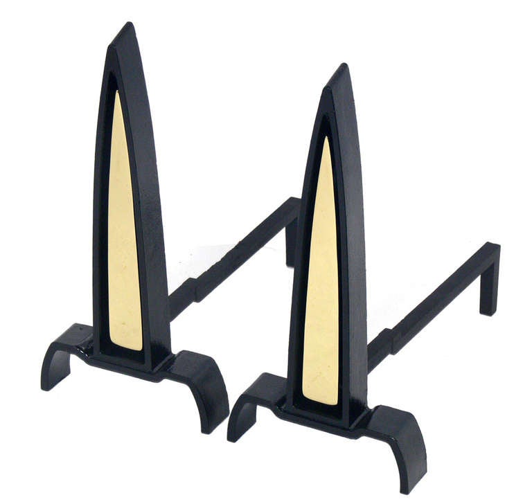 Black and Brass Spire Andirons designed by Donald Deskey for Bennett, circa 1950's. They have been completely restored with black enamel and the brass hand polished.