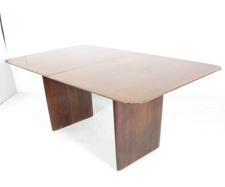 Elegant Modern Dining Table, designed by T.H. Robsjohn Gibbings for Widdicomb, American, circa 1950s. This table is currently being refinished and the price includes refinishing in your choice of color. The table is a versatile size and measures 70
