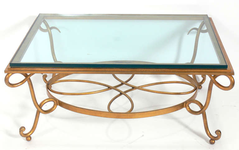Glamorous gilt metal coffee table in the manner of Rene Drouet, French, circa 1980s.