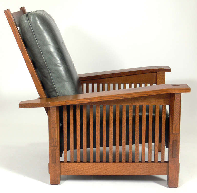 Stickley Mission Oak Morris Lounge Chair, American, circa 1990's.
Originally designed in 1915, this example is produced by The Stickley Company, circa 1990's. It has a clean lined architectural design. Quality heavyweight construction with thru