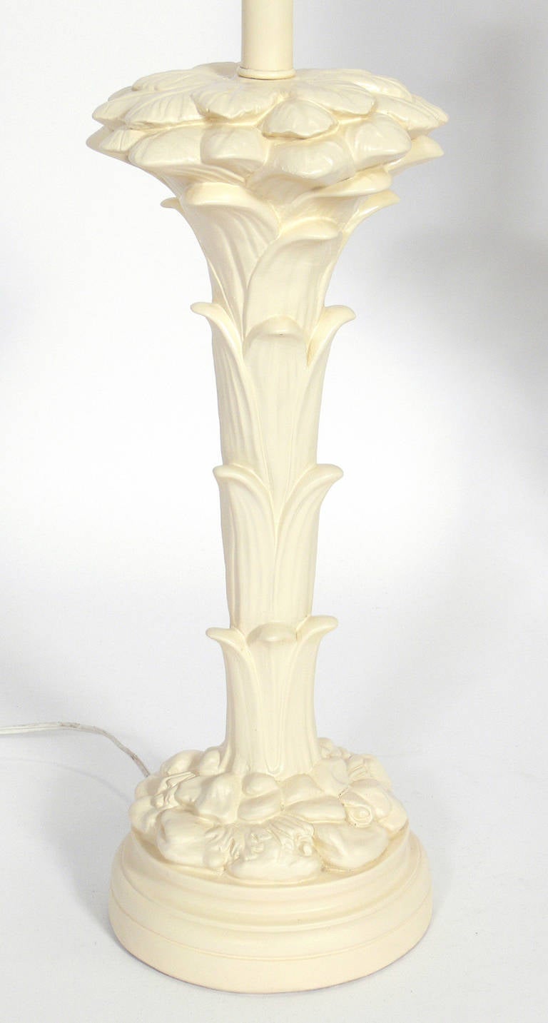 Pair of plaster floriform lamps in the manner of Serge Roche, American, circa 1950s. Elegant ivory color. Rewired and ready to use.