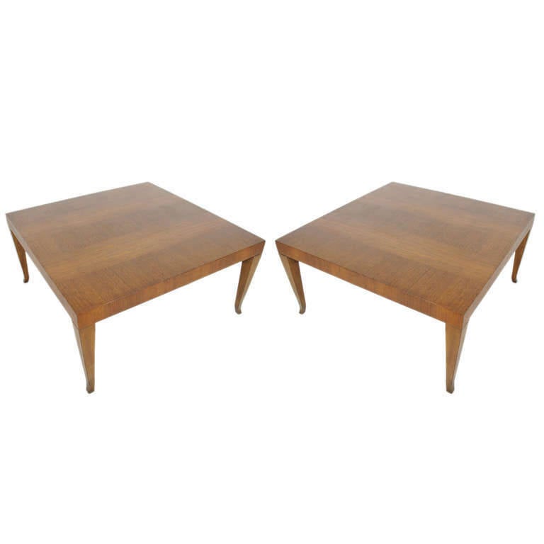Square Coffee Tables, or large end tables, designed by T.H. Robsjohn Gibbings for Widdicomb, circa 1950s. Sculptural splayed leg form and beautiful graining to the walnut. The tables are $4500 for the pair or $2500 each. These pieces are currently