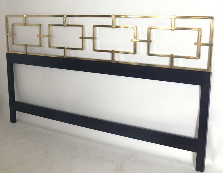 Glamorous Brass Link Headboard, designed for the Kittinger Company, circa 1950's. This piece has been completely restored with the brass hand polished and lacquered, and the wooden base refinished in an ultra-deep brown lacquer.