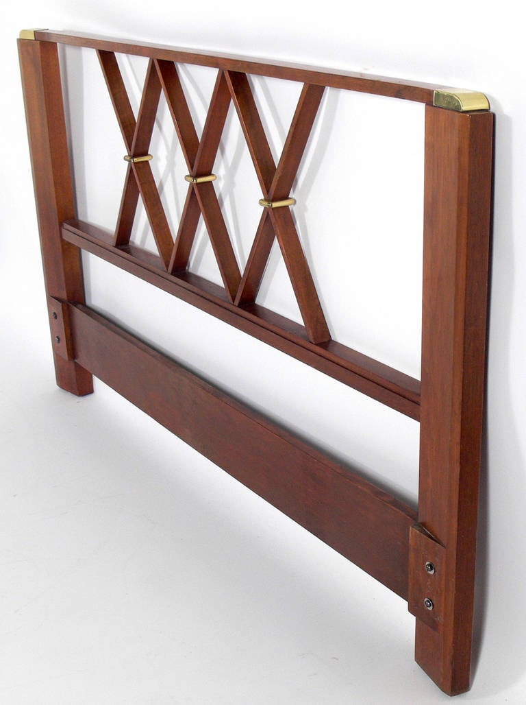 Elegant Walnut and Brass Headboard, in the manner of Tommi Parzinger, circa 1950s. This piece is currently being refinished and can be refinished in your choice of color. The price noted below includes refinishing in your choice of color.