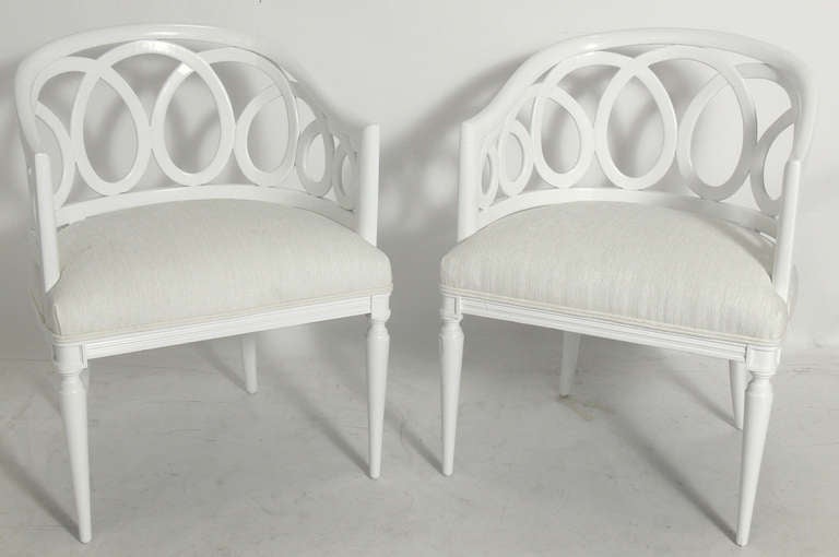 Pair of White Lacquer Loop Back Chairs, American, circa 1950's. Glamorous sculptural form. They have been completely restored with a new white color lacquer finish and reupholstered in a white faux velvet upholstery.