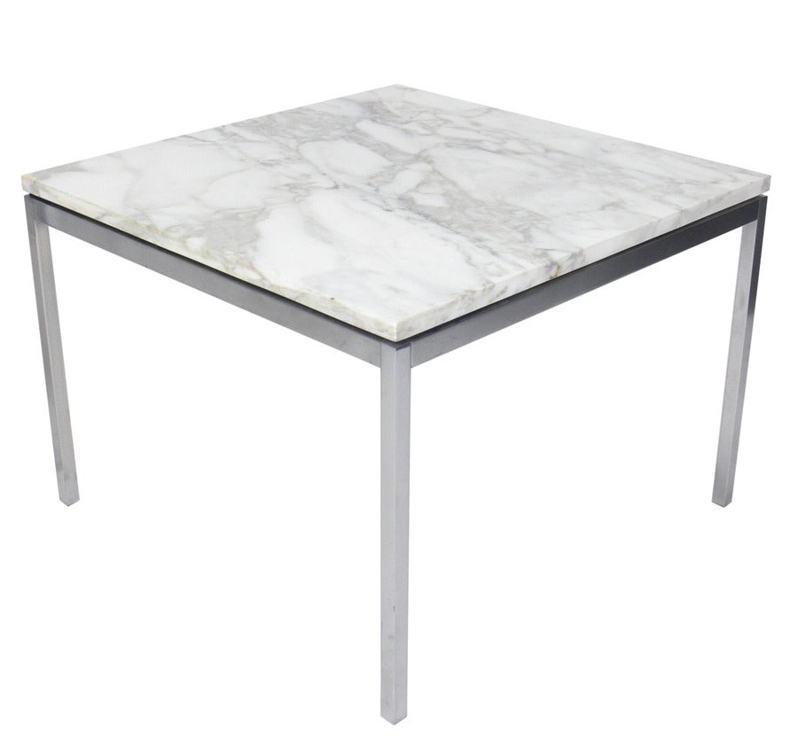 Pair of Knoll Marble and Chrome Tables, American, circa 1960's. They retain their original Calcatta marble tops in white with gray and tan veining. Polished chrome bases. They are a versatile size and can be used as end or side tables, or as night