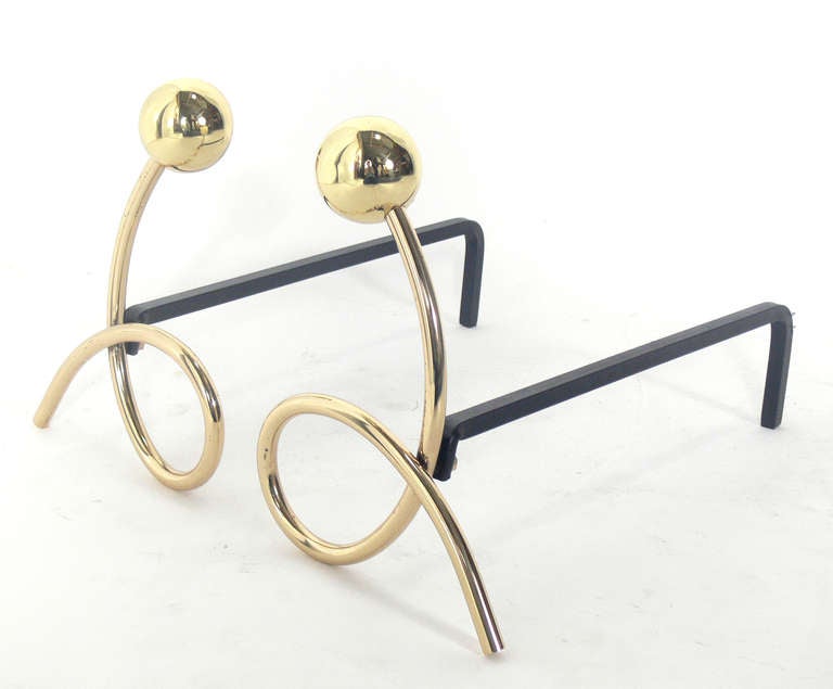 Whimsical Brass Loop Andirons, in the manner of Jean Royere, circa 1950's. Hand polished and lacquered.