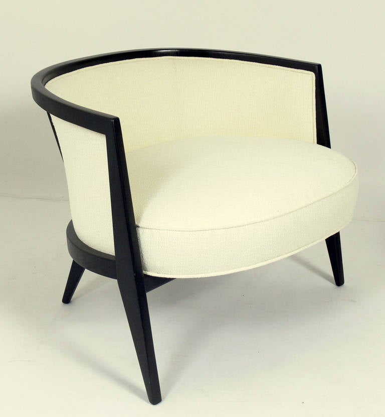 Pair of curvaceous modern lounge chairs, designed by Harvey Probber, circa 1960s. They have been completely restored in an ivory color bouclé fabric and an ultra deep brown lacquer.