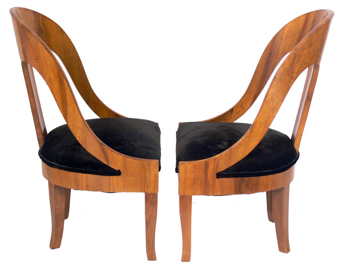 Elegant pair of Italian spoon back slipper chairs, circa 1940s. They retain their warm original patina.