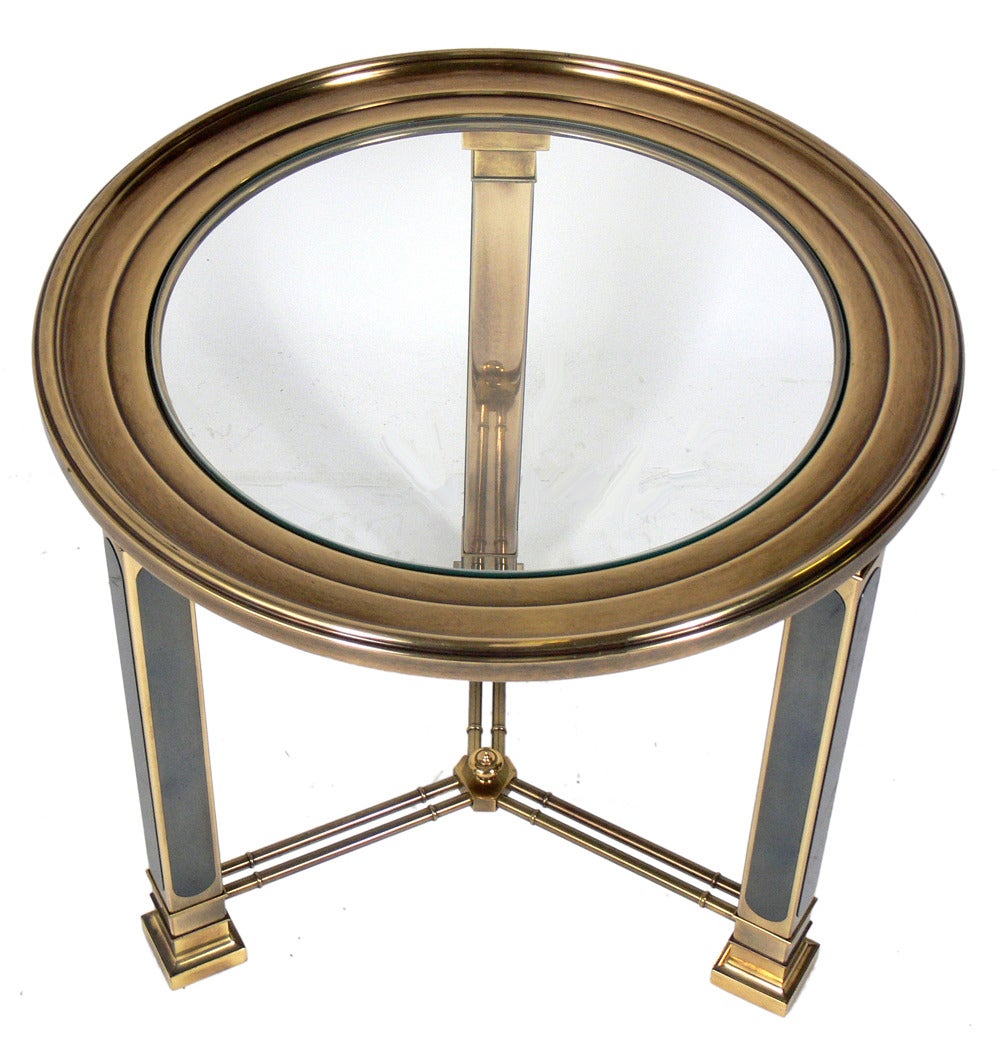 Brass and Gunmetal Side or Center Table by Mastercraft, American, circa 1960's. This piece is a versatile size and can be used as a side or end table, or night stand, or as a center table.