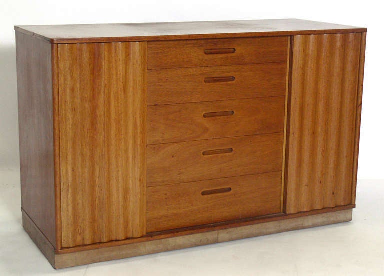Modern Credenza or Chest, designed by Edward Wormley for Dunbar, American, circa 1950's. This is a versatile piece and can be used as a credenza, bookshelf, or bar in a living area, or as a chest or dresser in a bedroom. This piece is currently