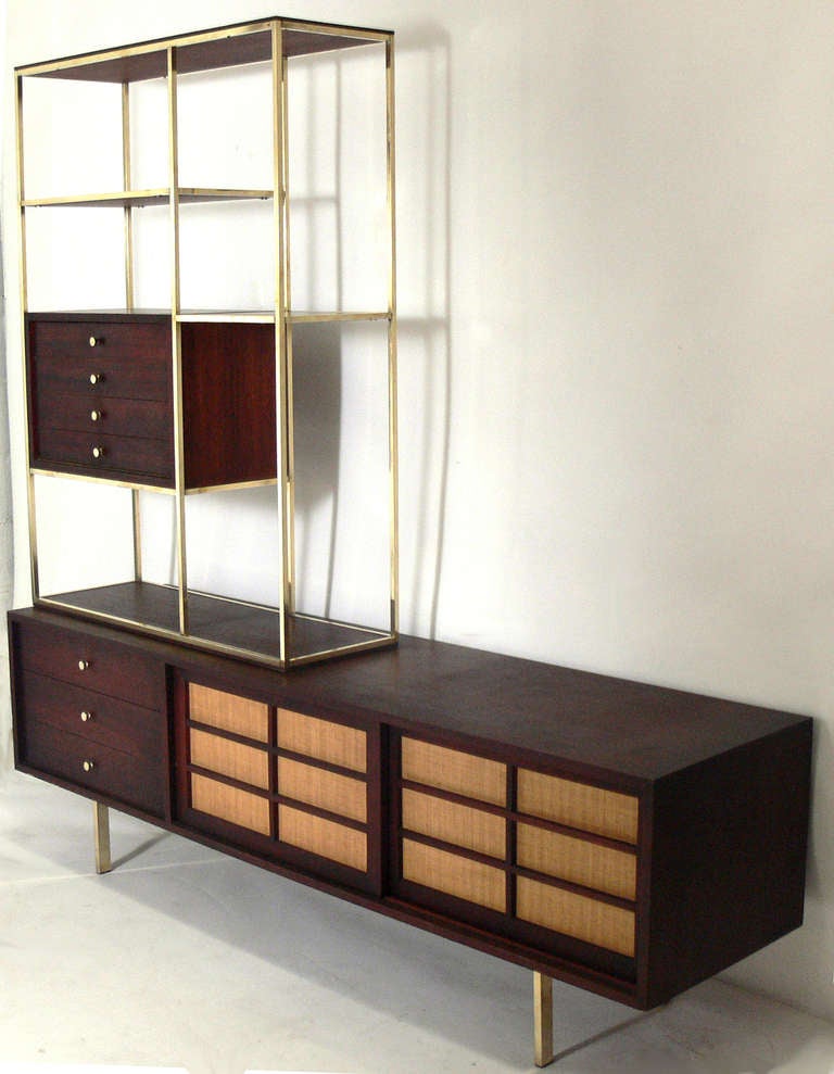 Modern Etagere and Credenza in the manner of Paul McCobb, American, circa 1950's. This is a versatile piece and can be used as a credenza, bookshelf, bar, or room divider in a living area, or as a chest or dresser in a bedroom. This piece is