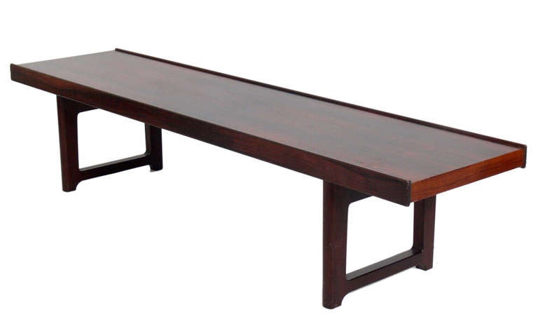 Danish Modern Rosewood Bench or Coffee Table, designed by Torbjorn Afdal, and manufactured by Mellemstrands Møbelfabrikk for Bruksbo of Norway, circa 1950's. This piece is currently being refinished. The price noted below includes refinishing and