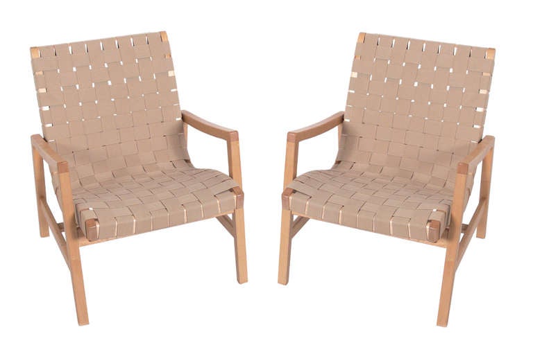 Pair of modern woven lounge chairs, designed by Jens Risom for Knoll. These classic chairs were designed circa 1950's, and these examples are circa 2000. Signed with Knoll Studio tag underneath.