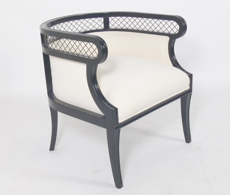Pair of Elegant Tub Chairs with Brass Lattice Backs, American, circa 1940's. They have been completely restored in a black color lacquer finish with ivory color boucle upholstery. The brass lattice retains it's warm original patina.