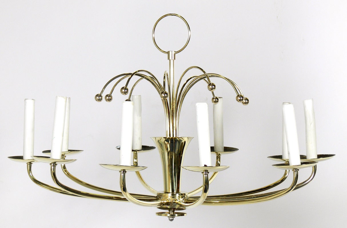 Modernist Brass Chandelier, in the manner of Tommi Parzinger, American, circa 1950's. This piece has been hand polished and lacquered. It is rewired and ready to use. It can be used with clip on shades if you prefer, see last photo below. Shades NOT