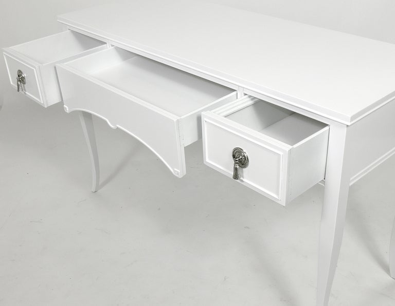 white desk with brass hardware