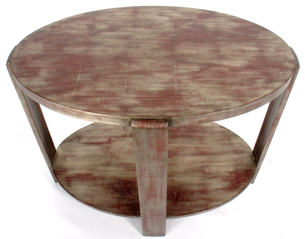 Silver Leaf Oval Console Table, circa 1940's. It has a very clean-lined form with wonderful patina and much wear to the silver leafing, beautifully exposing much of the Chinese Red underlayer or bole.