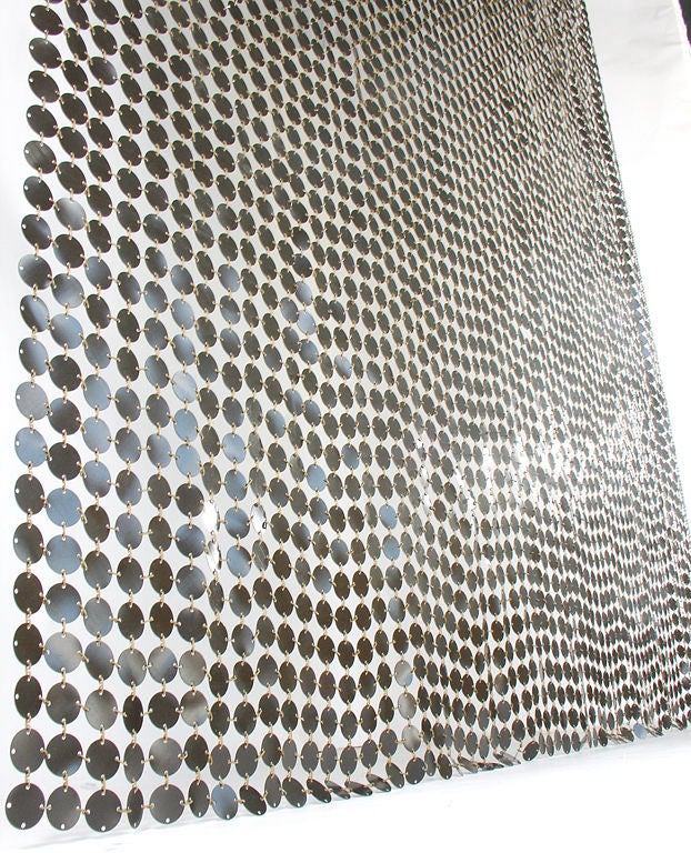 Space Curtain, designed by Paco Rabanne for Softwear/Baumann AG of Switzerland, circa 1970's. This piece is executed in deep brown plasticized aluminum discs with gold plastic clips. The clips make this a very versatile piece, and you can easily