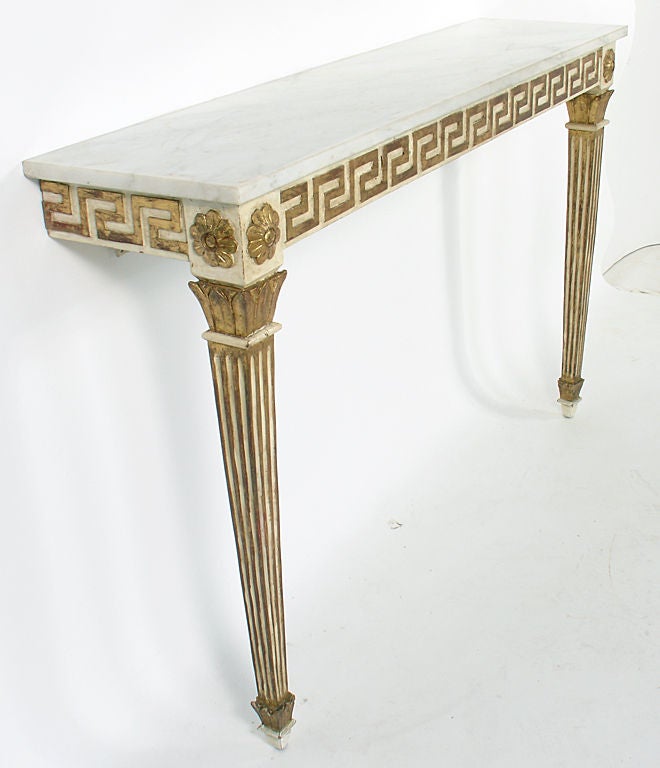 Elegant Console Table with Greek Key Decoration, Italian, circa 1930's. It retains it's wonderful original patina, lending contrast to the patinated gilt portions and the ivory enameled portions. The marble top is white in color with light grey
