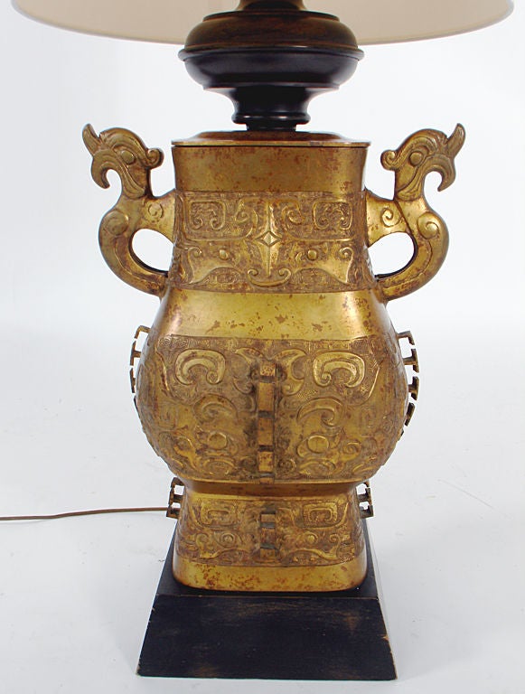 Large Scale Asian Form Bronze Lamp. We are unsure of the age of this lamp. It appears to be at least 1950's, due to the lamp fittings and hardware. The bronze vessel itself is believed to be Chinese or Japanese, and is likely much older than 1950's.