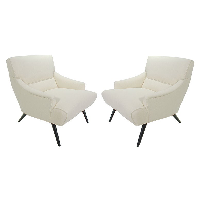 Pair of Modernist Lounge Chairs, Italian, circa 1950's. They have been completely restored, with the wooden legs finished in an ultra-deep brown lacquer, and newly upholstered in an ivory color boucle fabric. The price noted in this listing is for