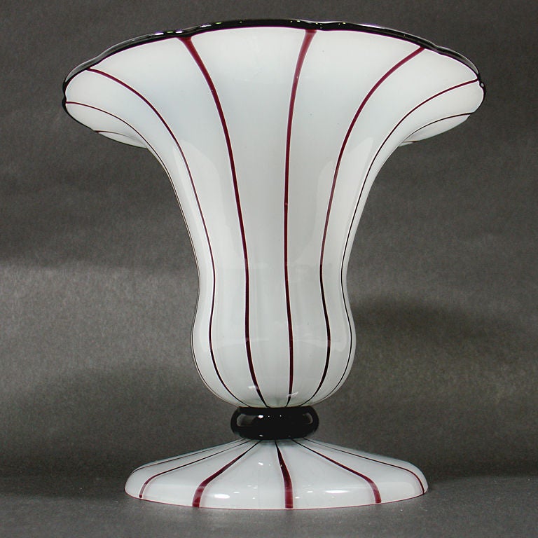 Elegant Trumpet Vase, designed by Michael Powolny for Loetz, circa 1914. It is executed in white and purple glass. Powolny designed these pieces for Loetz and they were marketed through the Wiener Werkstatte.