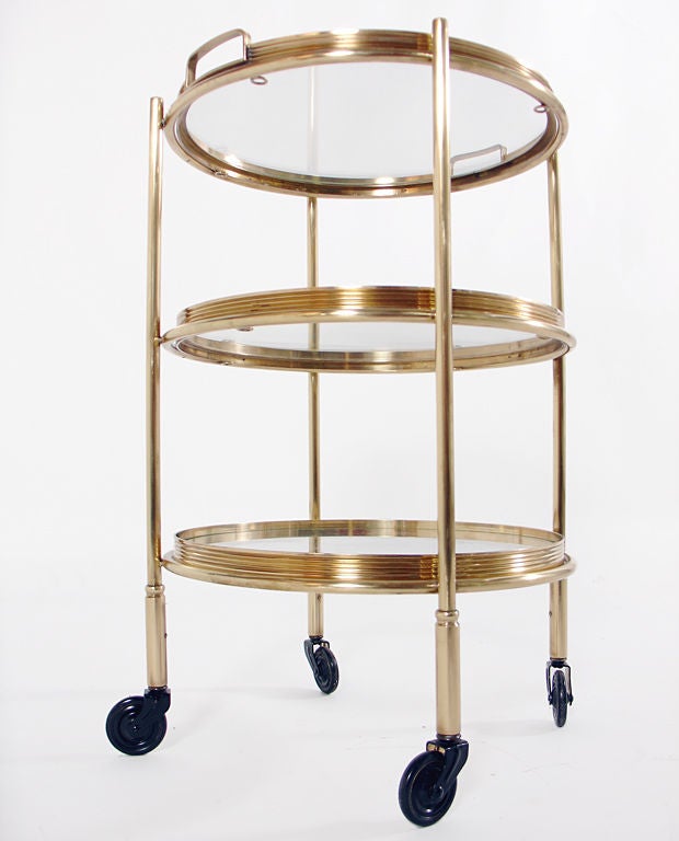 Elegant Brass Serving Tables and Cart for Entertaining, American, circa 1950's. The wheeled cart measures 22
