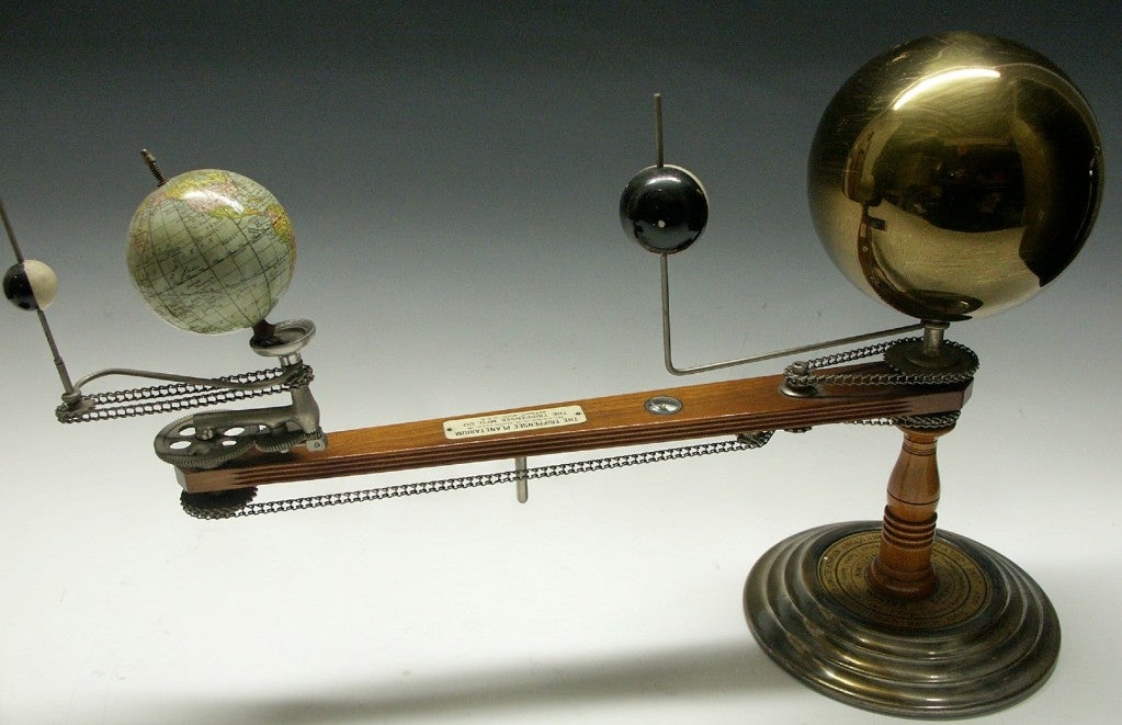 Exceptional example of early 1900's Planetarium Model.  These models were early educational tools used in schools to demonstrate how the Earth, Moon and Venus revolves around the Sun.  Chain driven, it shows how the seasons are created.  Primitive