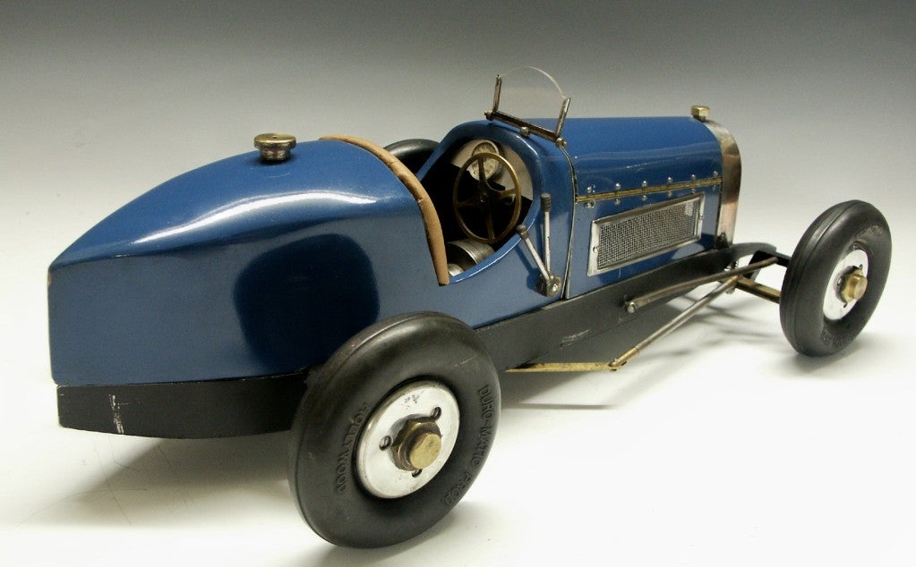 This is a large Bugatti race car model , based on the Bugatti T 35 Type.  It is a one of a kind, scratch built model and can be driven by its gas powered engine under the removable hood.  The car is completely hand made, using cast and sheet