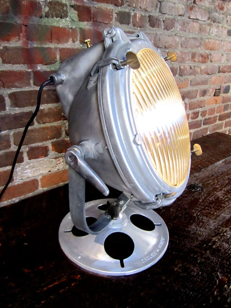 Guessing this industrial light was found on a ship.  This Crouse Hinds spot light has been beautifully refurbished.  Moves horizontally and laterally.  Can be placed high on an upper cabinet or used lower for back lighting.  Has been professionally