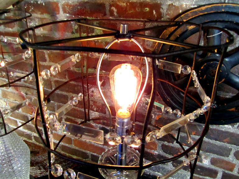These elegant crystal lamps meet a fabricated steel shade, showing an industrial flare.   Fun!